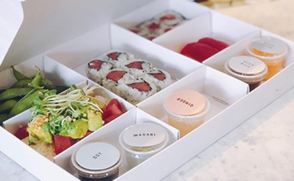 Image of a bento box of DK sushi and sides 
