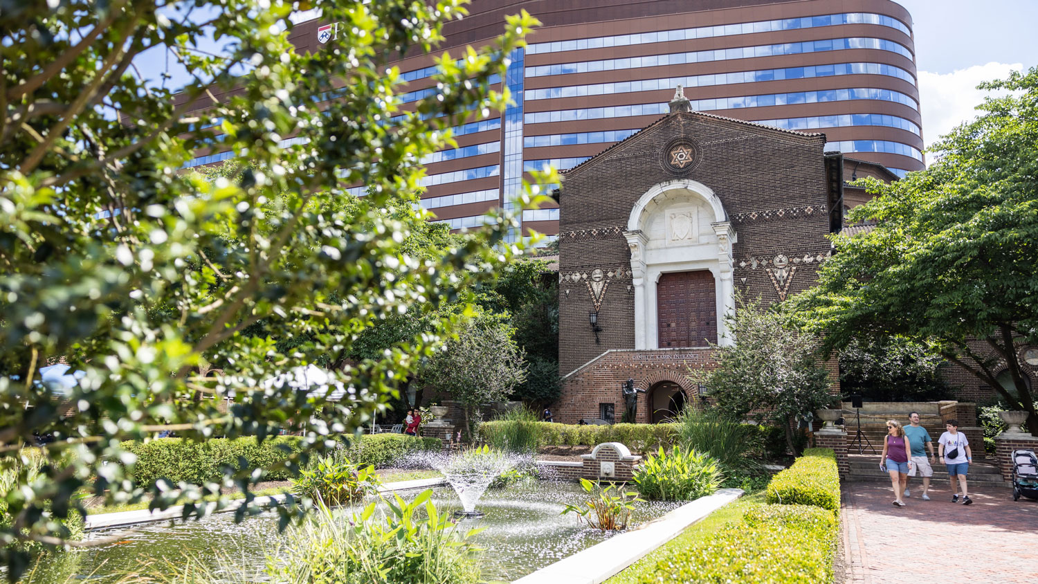 museum grounds and a fountain on a sunny day