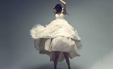 woman dancing in a flowing white dress