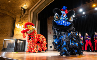 chinese dragon dancers perforing on a stage