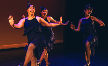 women dancing tap in flapper costumes