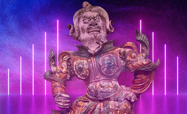 asian sculpture in front of neon lights
