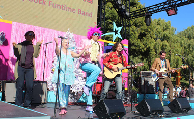 band in costumes performing on outdoor stage