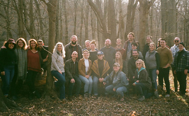 large group posing as a group in the woods