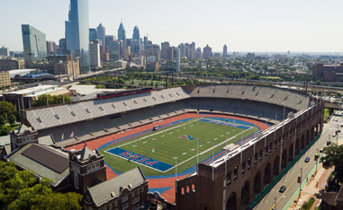 empty stadium with city skyline behind