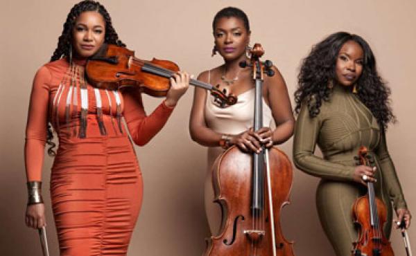 three african american women holding string instruments