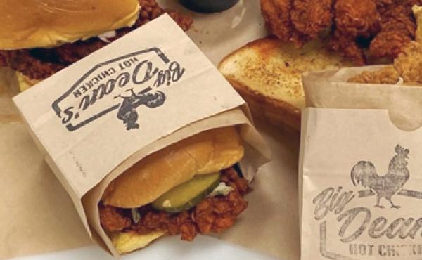 chicken sandwich and chicken fingers on a table