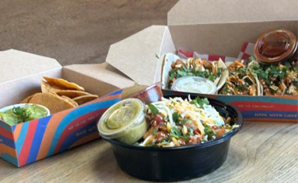 tacos, tortilla chips and a mexican bowl on a table
