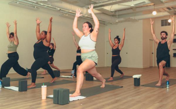men and women doing yoga