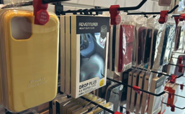 phone cases on hooks on the wall